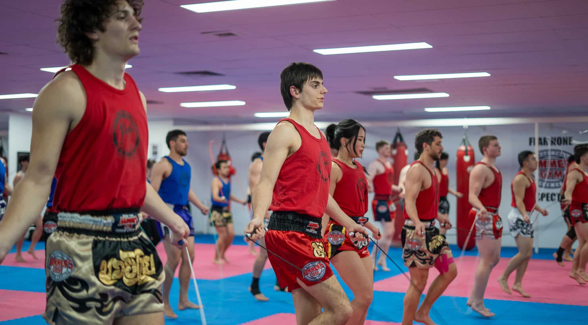 Muay Thai class warming up with skipping ropes at Hammer's Gym Nunawading