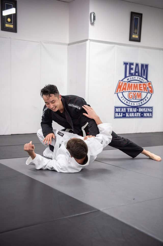 Brazilian Jiu Jitsu students rolling in gi on the mats at Hammer's Gym Nunawading