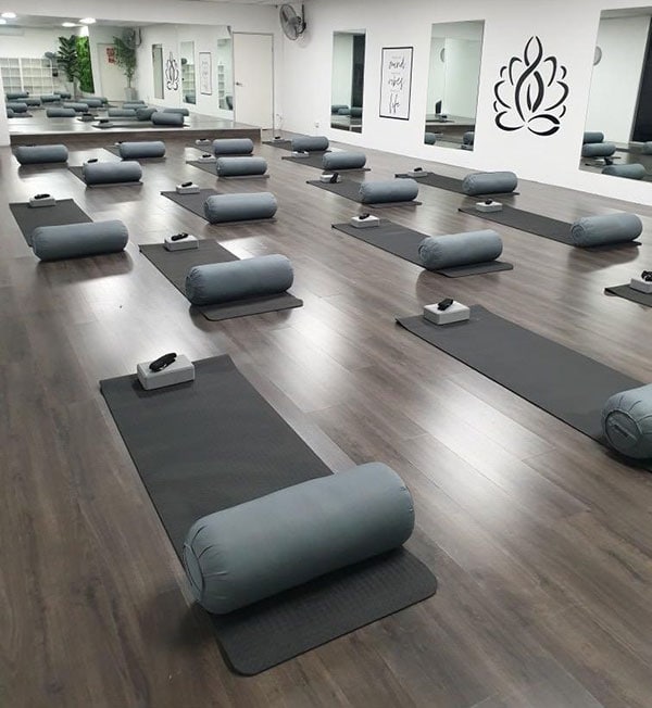 Yoga mats and foam rollers set up in the yoga studio at Hammer's Gym Nunawading