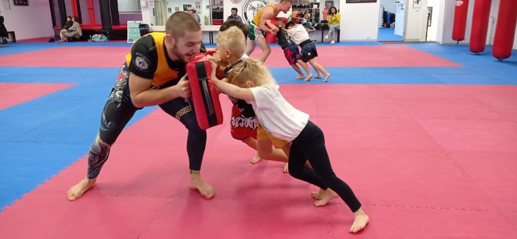 Two members drilling wrestling takedowns on the mats at Hammer's Gym Nunawading